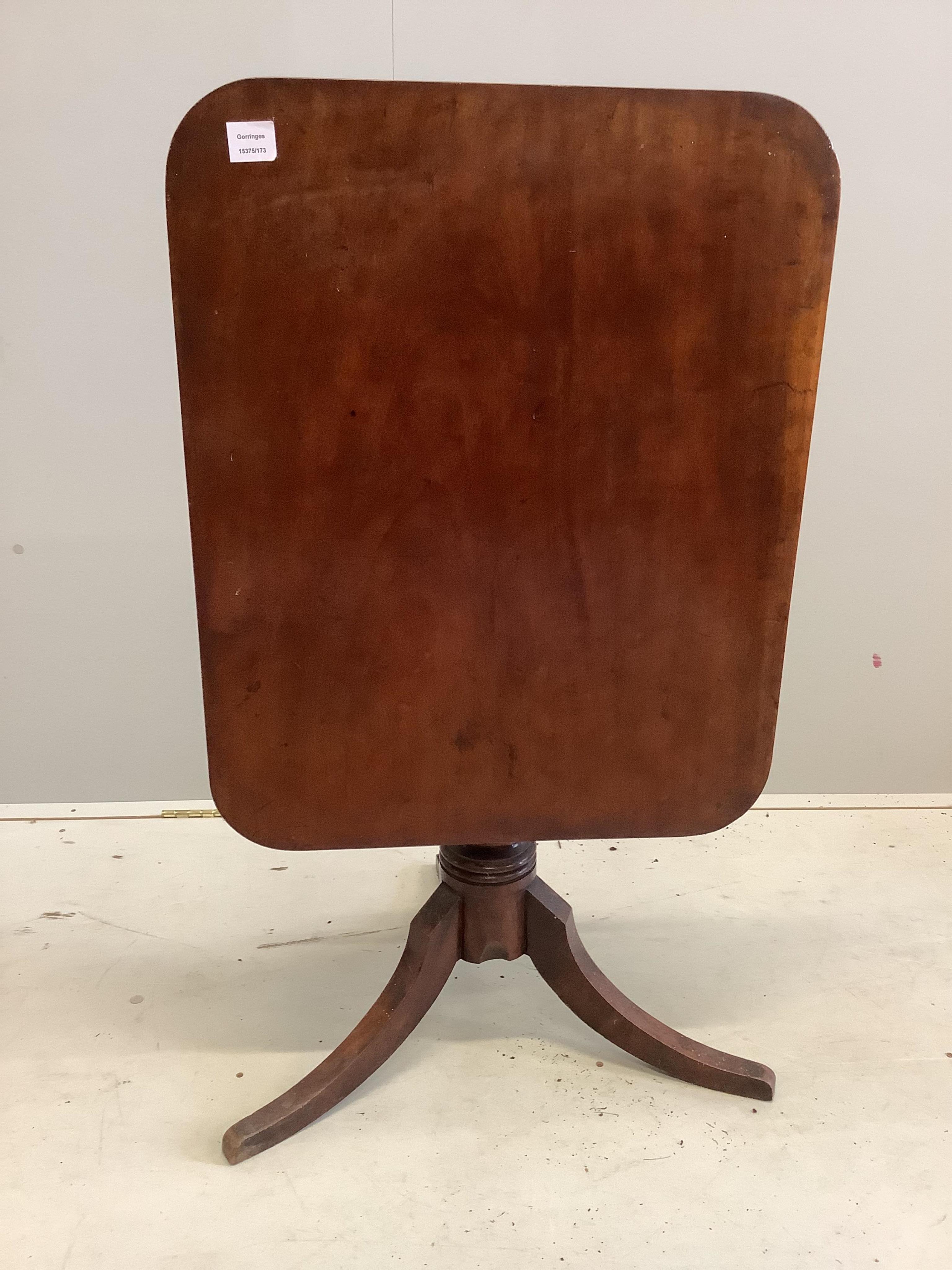 A Victorian rectangular mahogany tilt top tripod tea table, width 76cm, depth 61cm, height 67cm. Condition - fair